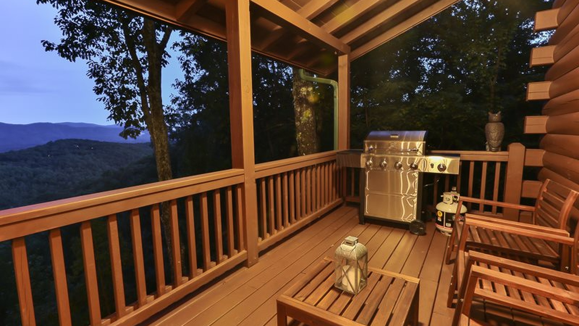 Propane grill on the main level deck for easy cabin dinners.